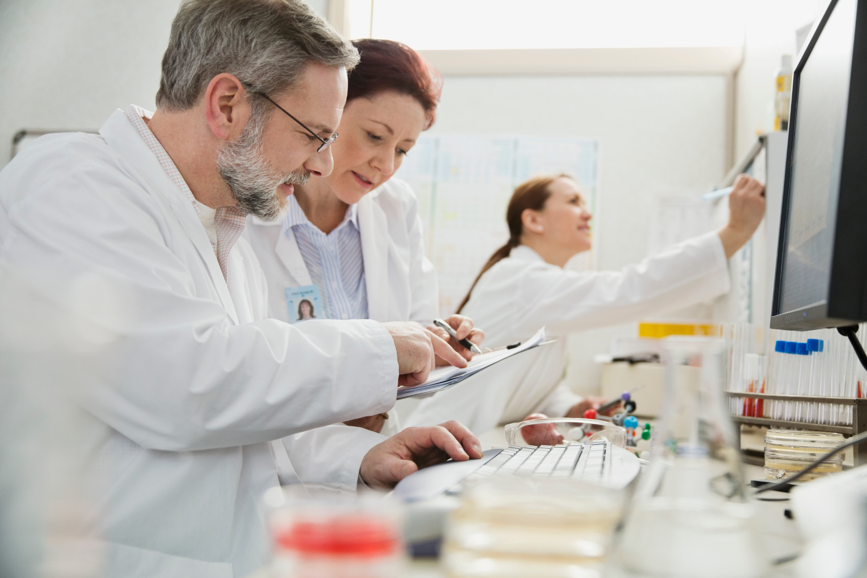 Doctor sitting at a computer in a practice laboratory