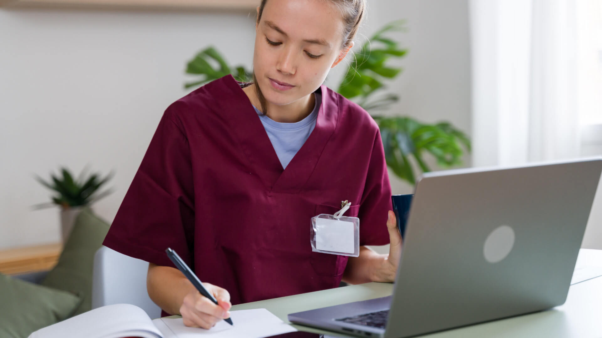 Doctor writing at her desk