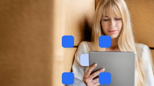 Woman sitting on the couch with a tablet