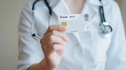 Doctor holding smc-b card 