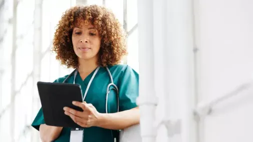 Female doctor with tablet