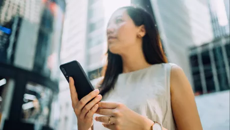 women smartphone standing outside