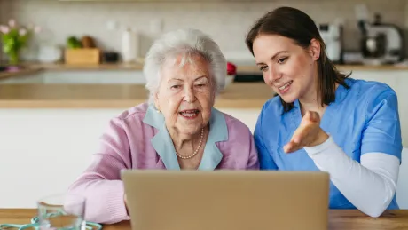 Senior Woman and Nurse at a Computer