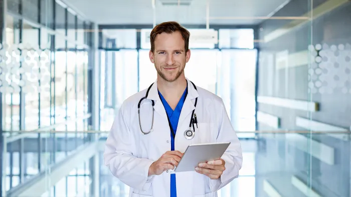 doctor with tablet