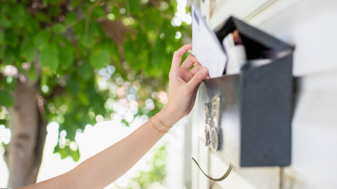 Letter is inserted into the letterbox.