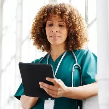  Female doctor with tablet